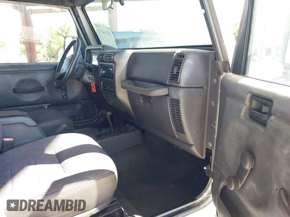 ✅ 2002 Jeep Wrangler Sport • VIN: 1J4FA49S12P700259 • Lot: 45134979. Listed on IAAI with 157,005 mi. Free auction sales archive from the USA and detailed vehicle history report at DreamBid. Image 5.