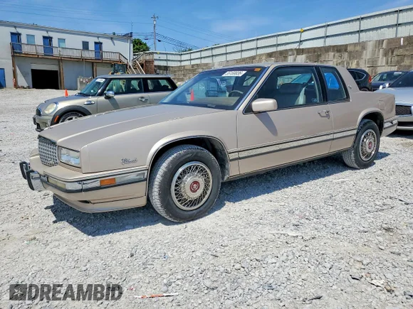 ✅ 1990 Cadillac Eldorado • VIN: 1G6EL1337LU607697 • Lot: 55169936. Wystawiony na Copart z przebiegiem 108 228 mil. Bezpłatny archiwum sprzedaży aukcyjnych z USA i szczegółowy raport historii pojazdu na DreamBid. Zdjęcie 1.
