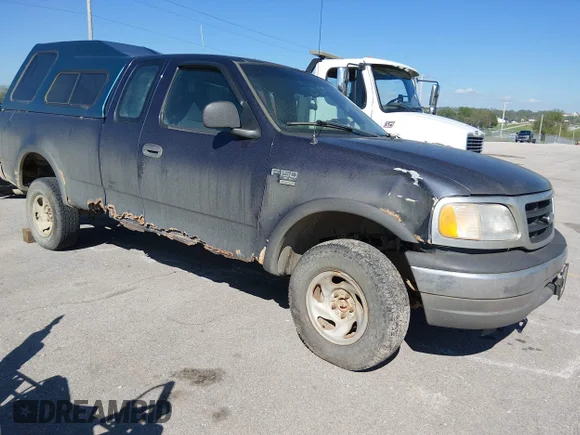 ✅ 1999 Ford F-150 • VIN: 1FTRX18W8XNB42594 • Lot: 44828388. Listed on IAAI with 166,989 mi. Free auction sales archive from the USA and detailed vehicle history report at DreamBid. Image 1.