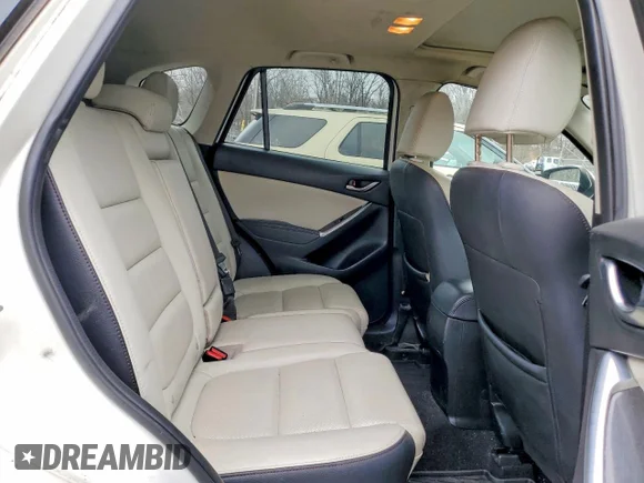 ✅ 2016 Mazda CX-5 Grand Touring • VIN: JM3KE4DYXG0779345 • Лот: 77113655. Опубликован ранее на Copart с пробегом 196 454 миль. Бесплатный доступ к архиву аукционных продаж из США и подробный отчёт об истории автомобиля на DreamBid. Изображение 10.