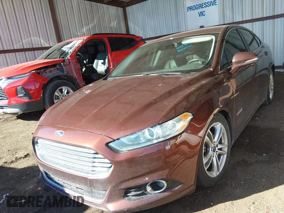 ✅ 2016 Ford Fusion Titanium Hybrid • VIN: 3FA6P0RU9GR206431 • Лот: 44395104. Опубліковано раніше на IAAI з пробігом 197 456 миль. Безкоштовний доступ до архіву аукціонних продажів зі США та докладний звіт про історію автомобіля на DreamBid. Зображення 2.