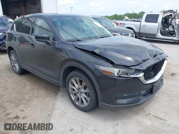 ✅ 2021 Mazda CX-5 Grand Touring • VIN: JM3KFBDM2M1306933 • Лот: 45150050. Опубликован ранее на IAAI с пробегом 110 656 миль. Бесплатный доступ к архиву аукционных продаж из США и подробный отчёт об истории автомобиля на DreamBid. Изображение 1.