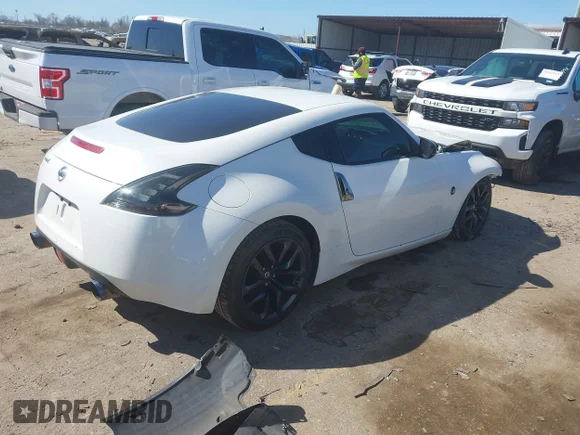 ✅ 2019 Nissan 370Z Nismo • VIN: JN1AZ4EH4KM420925 • Lot: 41671228. Wystawiony na IAAI z przebiegiem 89 578 mil. Bezpłatny archiwum sprzedaży aukcyjnych z USA i szczegółowy raport historii pojazdu na DreamBid. Zdjęcie 4.