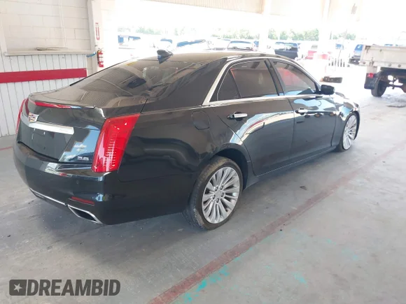 ✅ 2015 Cadillac CTS Performance RWD • VIN: 1G6AS5S31F0123918 • Lot: 42994728. Listed on IAAI with 112,724 mi. Free auction sales archive from the USA and detailed vehicle history report at DreamBid. Image 4.