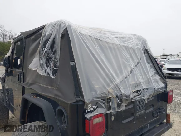 ✅ 2003 Jeep Wrangler X • VIN: 1J4FA39S33P375741 • Lot: 40858427. Listed on IAAI with Not provided. Free auction sales archive from the USA and detailed vehicle history report at DreamBid. Image 6.