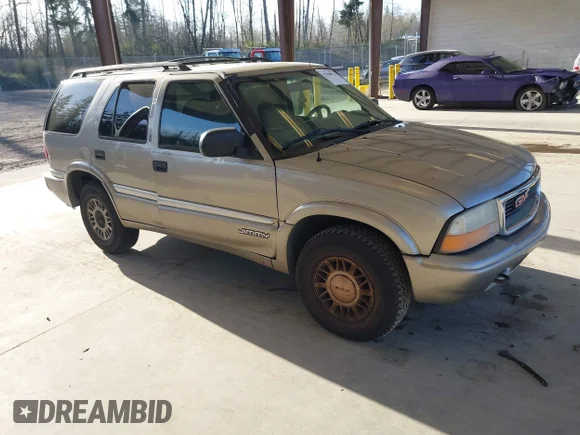 ✅ 2001 GMC Jimmy SLE • VIN: 1GKDT13W312140276 • Lot: 41960073. Listed on IAAI with 236,358 mi. Free auction sales archive from the USA and detailed vehicle history report at DreamBid. Image 1.