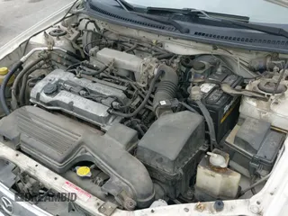 ✅ 2000 Mazda Protege DX • VIN: JM1BJ2220Y0273953 • Lot: 41956058. Listed on IAAI with 158,837 mi. Free auction sales archive from the USA and detailed vehicle history report at DreamBid. Image 20.