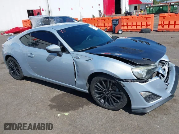 ✅ 2013 Scion FR-S • VIN: JF1ZNAA10D1732771 • Lot: 42014087. Listed on IAAI with 71,763 mi. Free auction sales archive from the USA and detailed vehicle history report at DreamBid. Image 1.