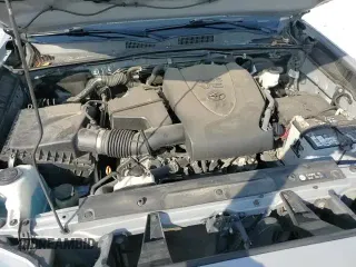 ✅ 2019 Toyota Tacoma SR5 • VIN: 5TFAZ5CN9KX081038 • Лот: 84897165. Опубликован ранее на Copart с пробегом 86 442 миль. Бесплатный доступ к архиву аукционных продаж из США и подробный отчёт об истории автомобиля на DreamBid. Изображение 15.