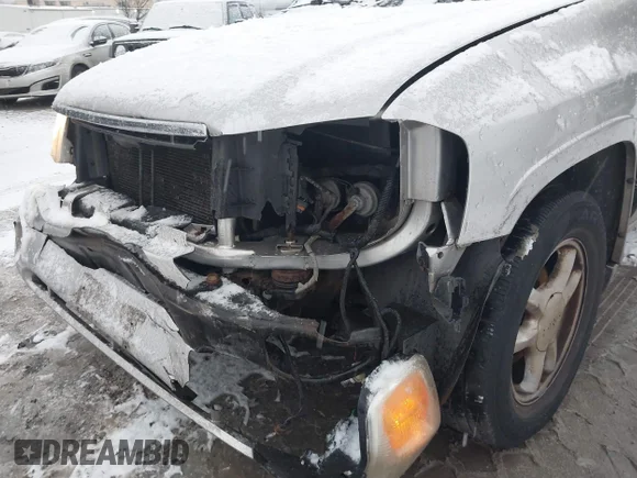✅ 2004 GMC Envoy SLE • VIN: 1GKDT13S342209209 • Lot: 43987828. Listed on IAAI with 179,196 mi. Free auction sales archive from the USA and detailed vehicle history report at DreamBid. Image 6.