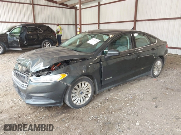 ✅ 2015 Ford Fusion S Hybrid • VIN: 3FA6P0UU7FR132609 • Lot: 42776760. Wystawiony na IAAI z przebiegiem 64 479 mil. Bezpłatny archiwum sprzedaży aukcyjnych z USA i szczegółowy raport historii pojazdu na DreamBid. Zdjęcie 2.