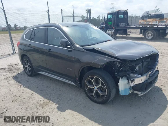 ✅ 2016 BMW X1 xDrive28i • VIN: WBXHT3C32G5E53055 • Lot: 42065536. Listed on IAAI with 40,040 mi. Free auction sales archive from the USA and detailed vehicle history report at DreamBid. Image 1.