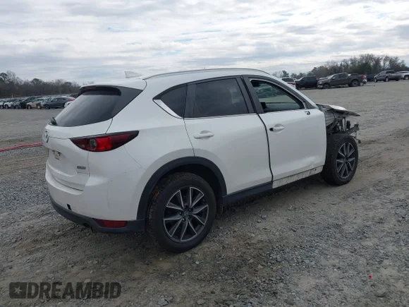✅ 2018 Mazda CX-5 Touring • VIN: JM3KFACMXJ1378213 • Lot: 44271907. Listed on IAAI with 174,307 mi. Free auction sales archive from the USA and detailed vehicle history report at DreamBid. Image 4.