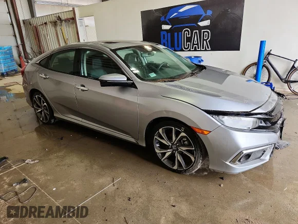 ✅ 2021 Honda Civic Touring • VIN: 19XFC1F93ME002027 • Лот: 53216616. Опубликован ранее на Copart с пробегом 20 092 миль. Бесплатный доступ к архиву аукционных продаж из США и подробный отчёт об истории автомобиля на DreamBid. Изображение 4.