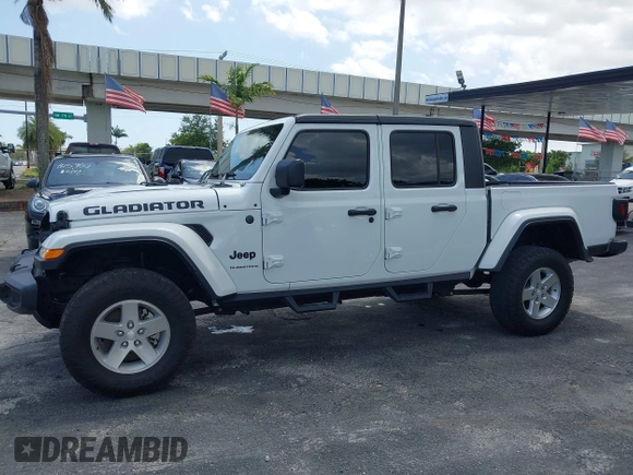 ✅ 2023 Jeep Gladiator Sport • VIN: 1C6JJTAGXPL571283 • Lot: 43096399. Wystawiony na IAAI z przebiegiem 49 808 mil. Bezpłatny archiwum sprzedaży aukcyjnych z USA i szczegółowy raport historii pojazdu na DreamBid. Zdjęcie 6.