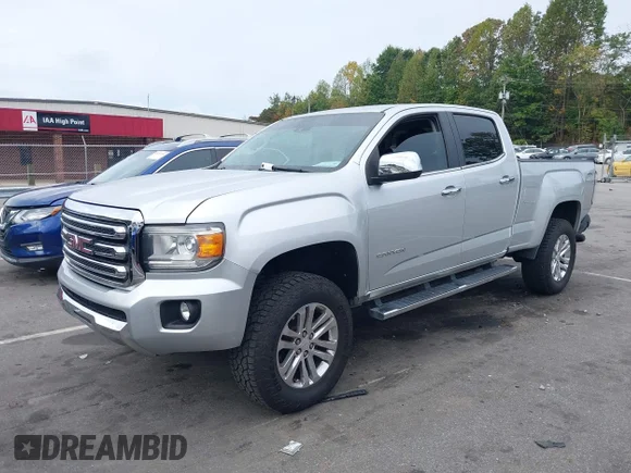 ✅ 2015 GMC Canyon 4WD SLT • VIN: 1GTG6CE35F1267557 • Lot: 43291058. Listed on IAAI with 168,968 mi. Free auction sales archive from the USA and detailed vehicle history report at DreamBid. Image 2.