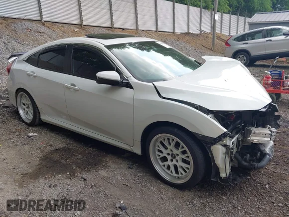 ✅ 2020 Honda Civic Si • VIN: 2HGFC1E54LH704456 • Lot: 42418950. Listed on IAAI with 112,076 mi. Free auction sales archive from the USA and detailed vehicle history report at DreamBid. Image 1.