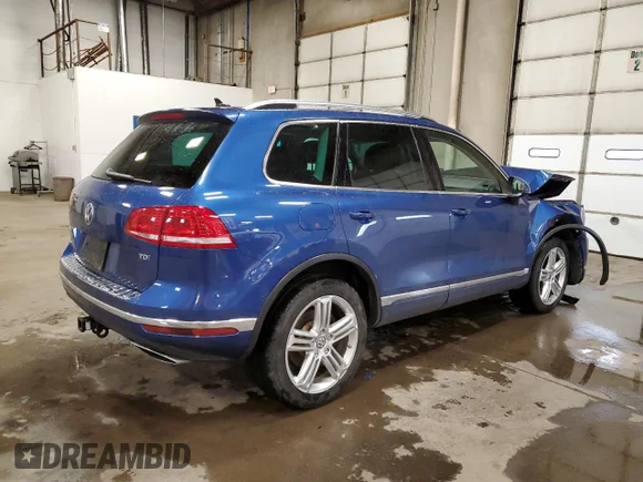 ✅ 2016 Volkswagen Touareg Lux • VIN: WVGEP9BPXGD001025 • Lot: 67449292. Listed on Copart with 111,683 mi. Free auction sales archive from the USA and detailed vehicle history report at DreamBid. Image 3.