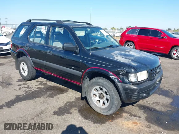 ✅ 1999 Isuzu Rodeo S • VIN: 4S2CK58W4X4365446 • Lot: 43280532. Wystawiony na IAAI z przebiegiem 199 353 mil. Bezpłatny archiwum sprzedaży aukcyjnych z USA i szczegółowy raport historii pojazdu na DreamBid. Zdjęcie 1.
