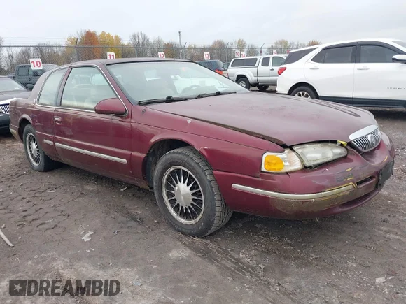 ✅ 1997 Mercury Cougar • VIN: 1MELM62W0VH609571 • Lot: 43581084. Listed on IAAI with 158,021 mi. Free auction sales archive from the USA and detailed vehicle history report at DreamBid. Image 1.