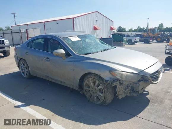✅ 2014 Mazda 6 i Touring • VIN: JM1GJ1V51E1107839 • Lot: 45241594. Listed on IAAI with 173,152 mi. Free auction sales archive from the USA and detailed vehicle history report at DreamBid. Image 1.