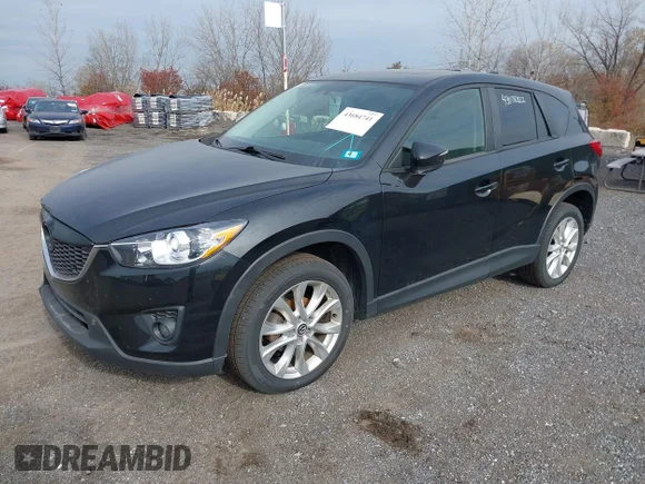 ✅ 2015 Mazda CX-5 Grand Touring • VIN: JM3KE4DY6F0533827 • Lot: 43684741. Listed on IAAI with 210,763 mi. Free auction sales archive from the USA and detailed vehicle history report at DreamBid. Image 2.
