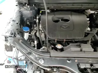 ✅ 2025 Mazda CX-5 S Carbon Edition • VIN: JM3KFBCM1S0692426 • Лот: 90807895. Опубликован ранее на Copart с пробегом 5 954 миль. Бесплатный доступ к архиву аукционных продаж из США и подробный отчёт об истории автомобиля на DreamBid. Изображение 15.