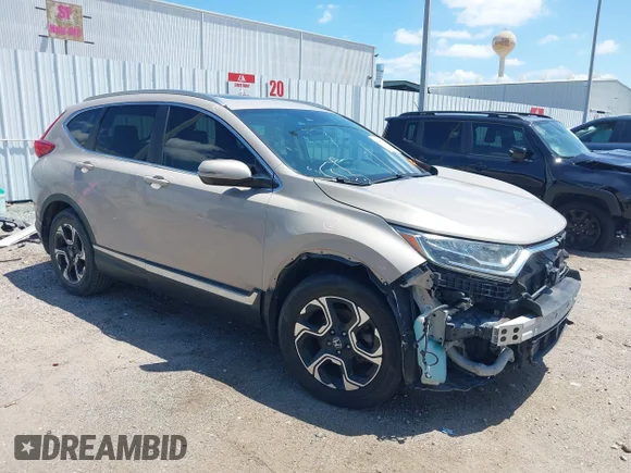 ✅ 2017 Honda CR-V Touring • VIN: 5J6RW1H95HL011661 • Lot: 45093924. Listed on IAAI with 124,245 mi. Free auction sales archive from the USA and detailed vehicle history report at DreamBid. Image 1.