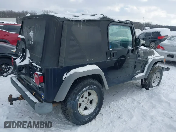 ✅ 2005 Jeep Wrangler Sport • VIN: 1J4FA49S25P324336 • Lot: 44249249. Listed on IAAI with 112,013 mi. Free auction sales archive from the USA and detailed vehicle history report at DreamBid. Image 4.