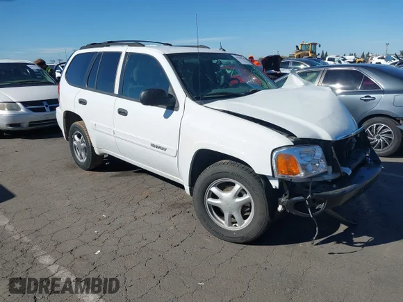 ✅ 2005 GMC Envoy SLT • VIN: 1GKDS13S552243303 • Lot: 43562030. Listed on IAAI with 124,329 mi. Free auction sales archive from the USA and detailed vehicle history report at DreamBid. Image 1.