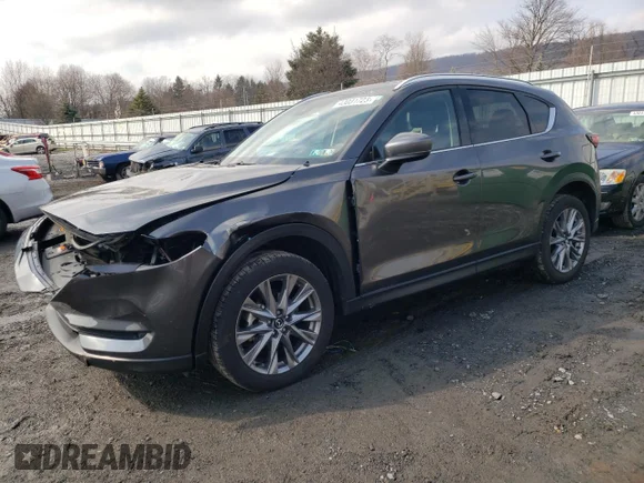 ✅ 2021 Mazda CX-5 Grand Touring • VIN: JM3KFBDMXM1380990 • Lot: 43031723. Wystawiony na Copart z przebiegiem 21 145 mil. Bezpłatny archiwum sprzedaży aukcyjnych z USA i szczegółowy raport historii pojazdu na DreamBid. Zdjęcie 1.