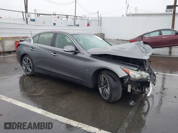 ✅ 2015 Infiniti Q50 Premium • VIN: JN1BV7AP9FM335597 • Lot: 44052423. Listed on IAAI with 99,149 mi. Free auction sales archive from the USA and detailed vehicle history report at DreamBid. Image 1.