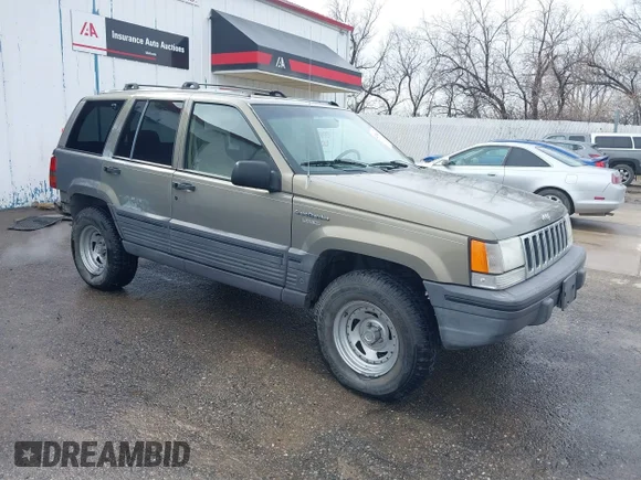 ✅ 1995 Jeep Grand Cherokee Laredo • VIN: 1J4FX58S2SC693240 • Lot: 41796871. Listed on IAAI with 208,482 mi. Free auction sales archive from the USA and detailed vehicle history report at DreamBid. Image 1.