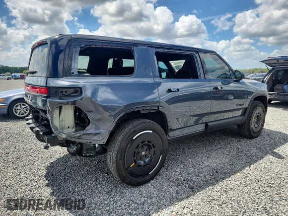 ✅ 2025 Rivian R1S Adventure • VIN: 7PDSGBBA5SN058254 • Лот: 48146566. Опубликован ранее на Copart с пробегом 23 959 миль. Бесплатный доступ к архиву аукционных продаж из США и подробный отчёт об истории автомобиля на DreamBid. Изображение 3.