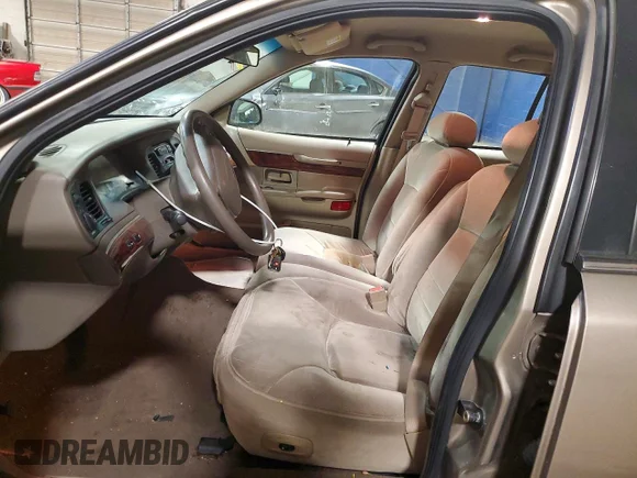 ✅ 2002 Mercury Grand Marquis GS • VIN: 2MEFM74W62X621297 • Lot: 77518475. Wystawiony na Copart z przebiegiem 86 031 mil. Bezpłatny archiwum sprzedaży aukcyjnych z USA i szczegółowy raport historii pojazdu na DreamBid. Zdjęcie 7.