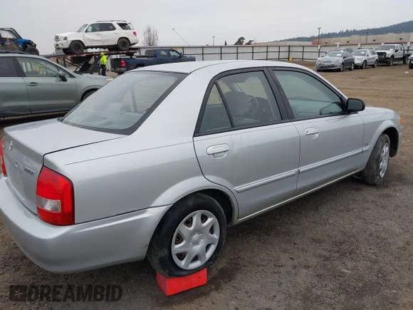 ✅ 2000 Mazda Protege DX • VIN: JM1BJ222XY0197075 • Lot: 44210798. Wystawiony na IAAI z przebiegiem 60 998 mil. Bezpłatny archiwum sprzedaży aukcyjnych z USA i szczegółowy raport historii pojazdu na DreamBid. Zdjęcie 4.