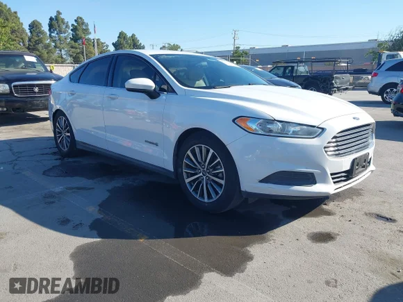 ✅ 2015 Ford Fusion S Hybrid • VIN: 3FA6P0UUXFR128568 • Lot: 45143469. Wystawiony na IAAI z przebiegiem 198 791 mil. Bezpłatny archiwum sprzedaży aukcyjnych z USA i szczegółowy raport historii pojazdu na DreamBid. Zdjęcie 1.