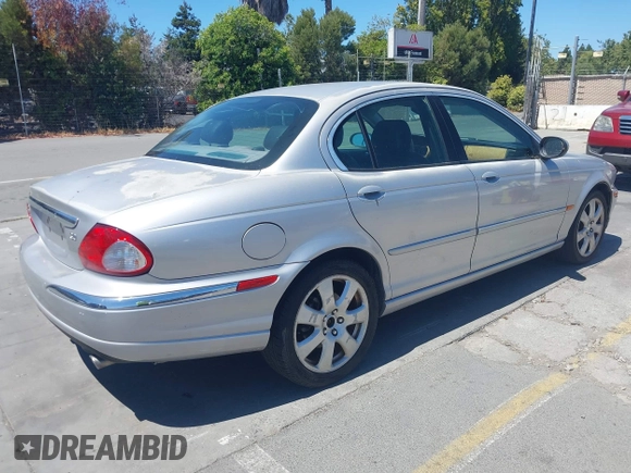 ✅ 2004 Jaguar X-Type • VIN: SAJEA51C14WD75556 • Lot: 42910011. Listed on IAAI with 132,649 mi. Free auction sales archive from the USA and detailed vehicle history report at DreamBid. Image 4.