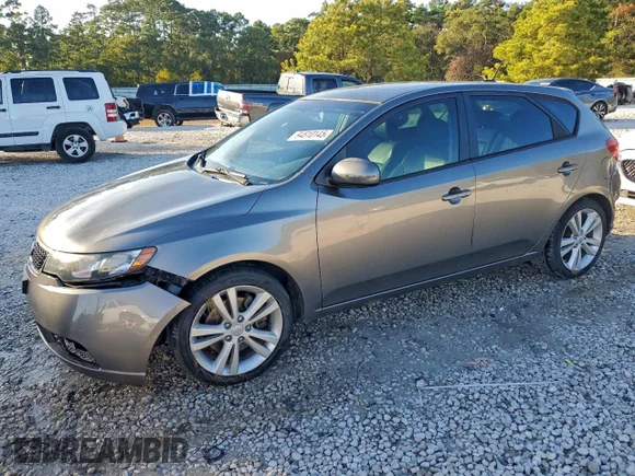 ✅ 2012 Kia Forte SX • VIN: KNAFW5A36C5476997 • Lot: 94810145. Wystawiony na Copart z przebiegiem 111 800 mil. Bezpłatny archiwum sprzedaży aukcyjnych z USA i szczegółowy raport historii pojazdu na DreamBid. Zdjęcie 1.