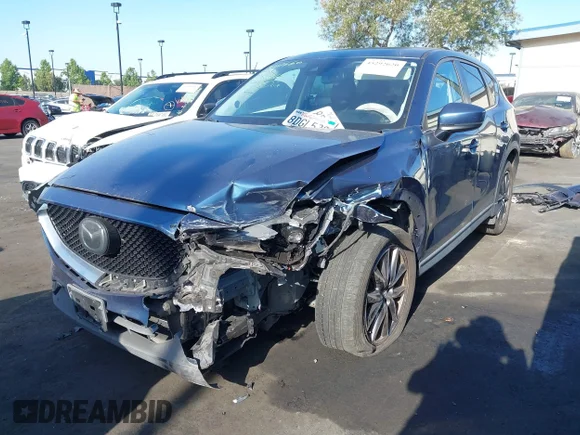 ✅ 2018 Mazda CX-5 Touring • VIN: JM3KFACM3J0363848 • Lot: 45292620. Listed on IAAI with 143,904 mi. Free auction sales archive from the USA and detailed vehicle history report at DreamBid. Image 6.