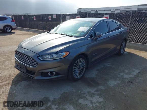 ✅ 2014 Ford Fusion Titanium Hybrid • VIN: 3FA6P0RU6ER121835 • Лот: 44538774. Опубликован ранее на IAAI с пробегом 240 861 миль. Бесплатный доступ к архиву аукционных продаж из США и подробный отчёт об истории автомобиля на DreamBid. Изображение 2.