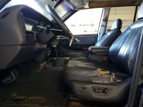 ✅ 1997 Jeep Grand Cherokee Laredo • VIN: 1J4GZ58S5VC678430 • Лот: 74044985. Опубліковано раніше на Copart з пробігом Не вказано. Безкоштовний доступ до архіву аукціонних продажів зі США та докладний звіт про історію автомобіля на DreamBid. Зображення 7.