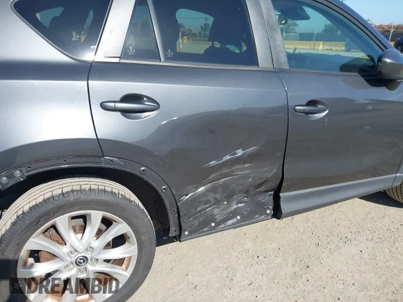 ✅ 2014 Mazda CX-5 Grand Touring • VIN: JM3KE4DY9E0309157 • Lot: 45292864. Listed on IAAI with 112,931 mi. Free auction sales archive from the USA and detailed vehicle history report at DreamBid. Image 6.