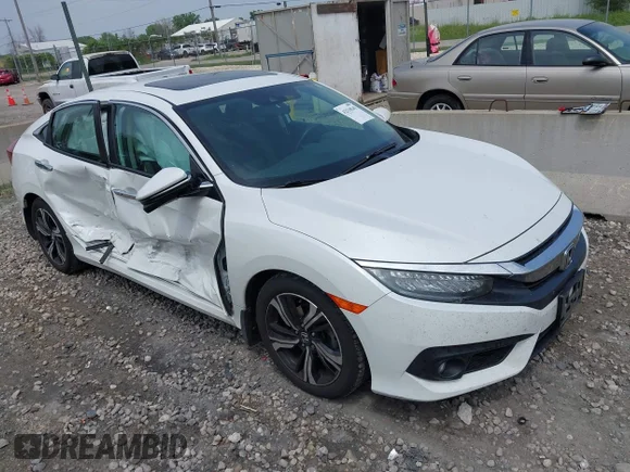 ✅ 2017 Honda Civic Touring • VIN: 19XFC1F95HE012483 • Lot: 42518549. Wystawiony na IAAI z przebiegiem 138 580 mil. Bezpłatny archiwum sprzedaży aukcyjnych z USA i szczegółowy raport historii pojazdu na DreamBid. Zdjęcie 1.