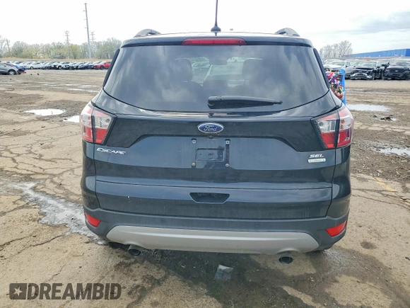 ✅ 2018 Ford Escape SEL • VIN: 1FMCU0HD5JUB10623 • Lot: 51017146. Wystawiony na Copart z przebiegiem 82 318 mil. Bezpłatny archiwum sprzedaży aukcyjnych z USA i szczegółowy raport historii pojazdu na DreamBid. Zdjęcie 6.