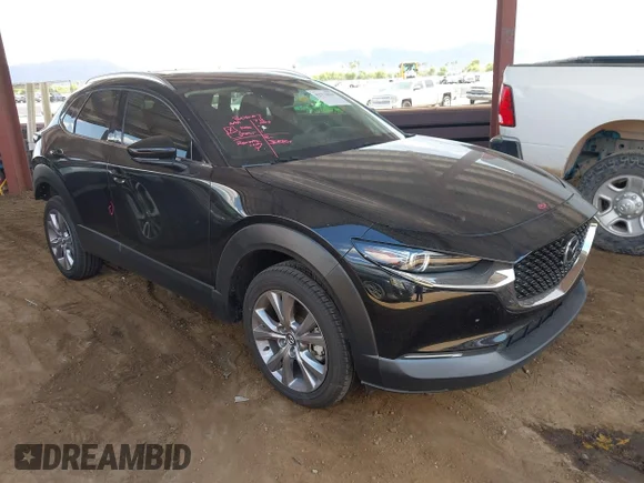 ✅ 2022 Mazda CX-30 S Premium • VIN: 3MVDMBDL0NM404344 • Лот: 42773031. Опубліковано раніше на IAAI з пробігом 55 493 миль. Безкоштовний доступ до архіву аукціонних продажів зі США та докладний звіт про історію автомобіля на DreamBid. Зображення 1.