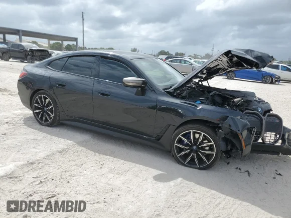 ✅ 2024 BMW i4 M50 • VIN: WBY33AW0XRFS69522 • Лот: 47896615. Опубликован ранее на Copart с пробегом 17 041 миль. Бесплатный доступ к архиву аукционных продаж из США и подробный отчёт об истории автомобиля на DreamBid. Изображение 4.