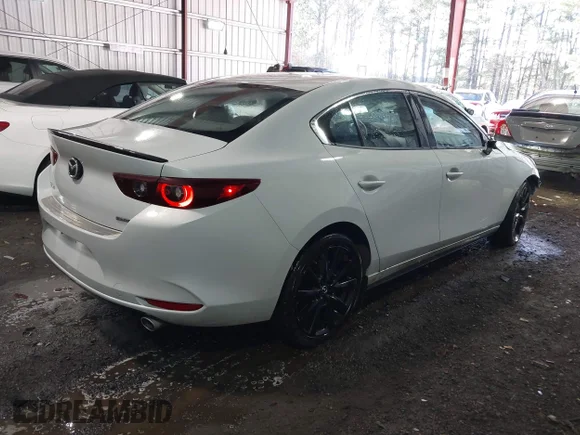 ✅ 2024 Mazda 3 S Select Sport • VIN: 3MZBPABM8RM411521 • Лот: 44131901. Опубликован ранее на IAAI с пробегом 28 298 миль. Бесплатный доступ к архиву аукционных продаж из США и подробный отчёт об истории автомобиля на DreamBid. Изображение 4.