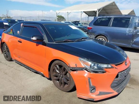 ✅ 2015 Scion tC • VIN: JTKJF5C78FJ008786 • Lot: 43083984. Listed on IAAI with 256,602 mi. Free auction sales archive from the USA and detailed vehicle history report at DreamBid. Image 1.