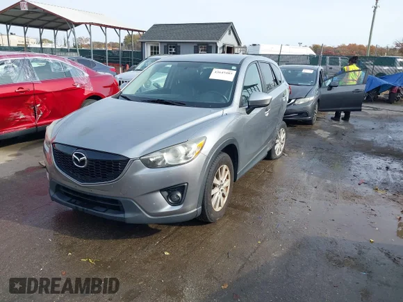 ✅ 2014 Mazda CX-5 Touring • VIN: JM3KE2CY6E0369208 • Lot: 43645405. Wystawiony na IAAI z przebiegiem 158 964 mil. Bezpłatny archiwum sprzedaży aukcyjnych z USA i szczegółowy raport historii pojazdu na DreamBid. Zdjęcie 2.